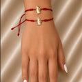 RED STRING BRACELET WITH PENGUIN CHARM