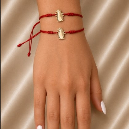 RED STRING BRACELET WITH PENGUIN CHARM